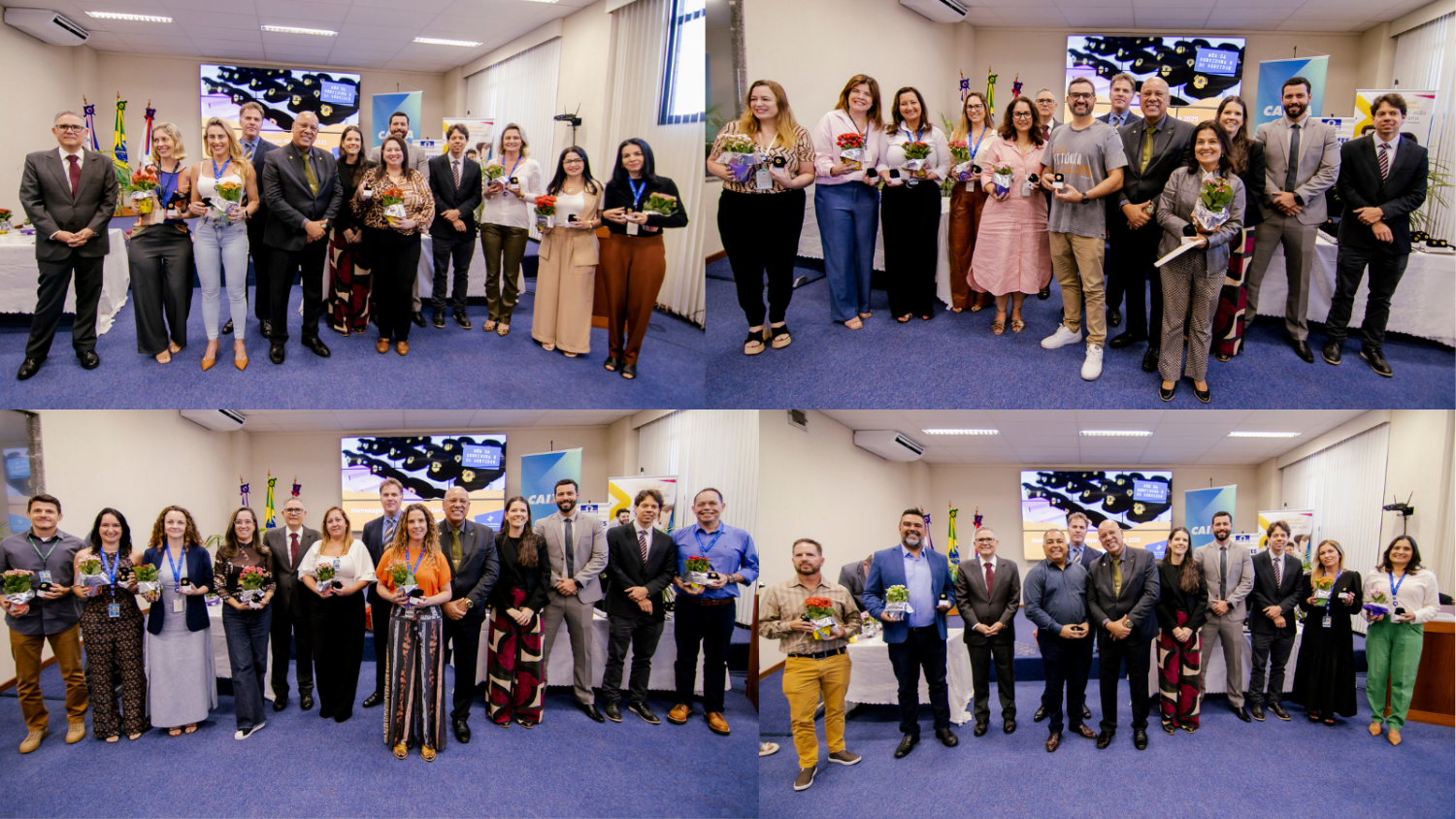 Servidores e dirigentes posam em grupos, sorrindo com medalhas e flores durante a cerimônia de homenagem.